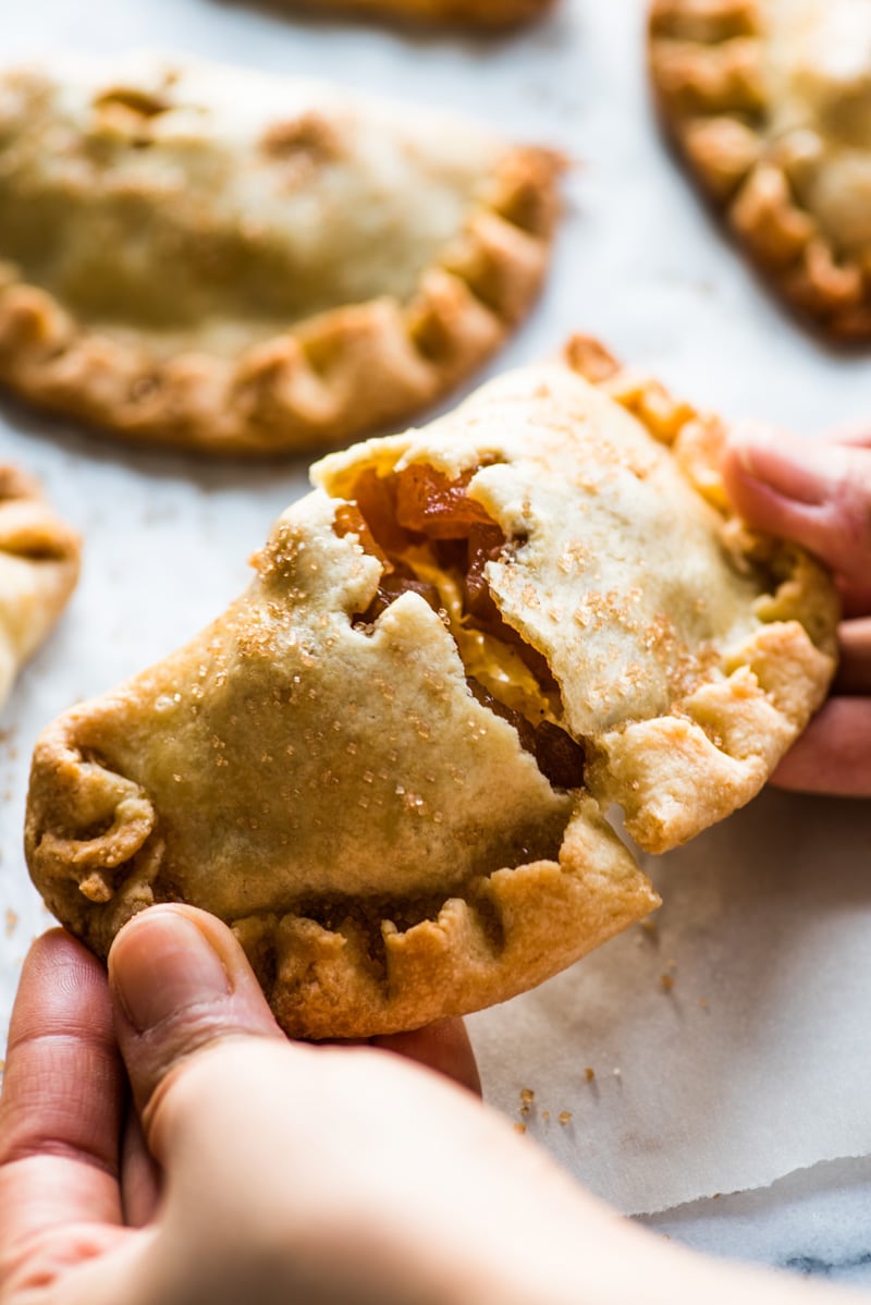 Baked Apple Empanadas are the perfect dessert for the fall and winter seasons! They're portable, delicious and super addicting.