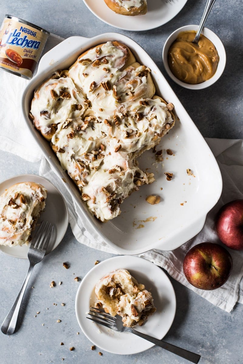 These Dulce de Leche Cinnamon Rolls stuffed with apples and pecans are the perfect fall and winter treat made with a Mexican twist!