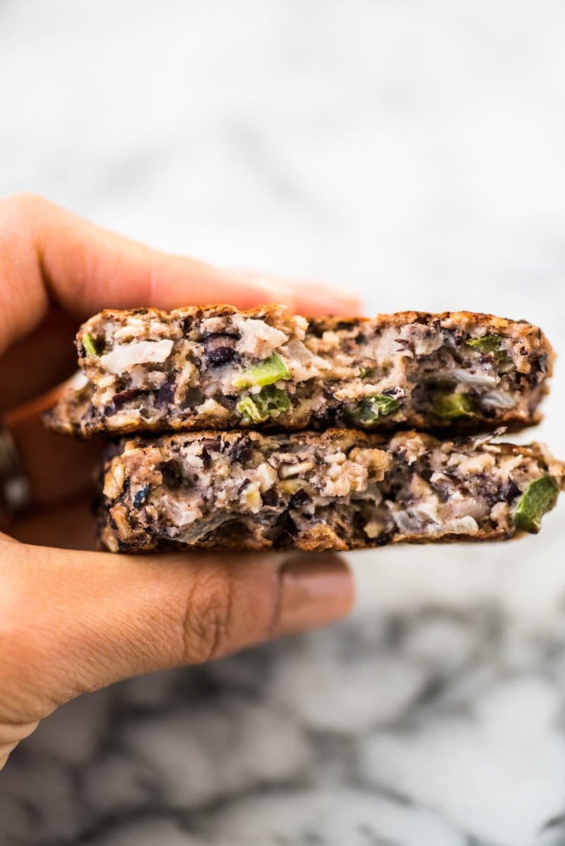 These Black Bean Patties are crispy on the outside, creamy on the inside and served with a cilantro yogurt sauce. Makes tasty black bean burgers! #vegetarian #blackbeanburger #veggieburger #blackbeans