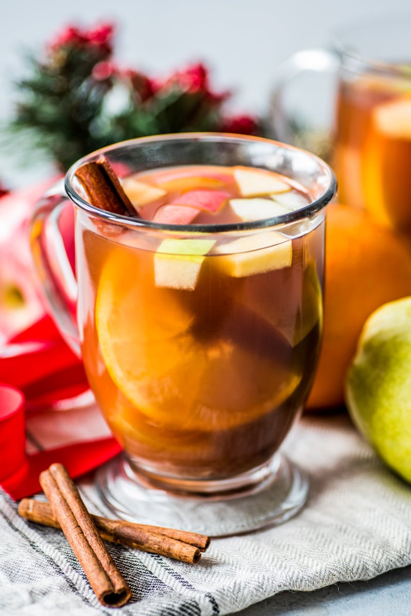 Mexican Ponche is a warm and comforting fruit punch made with apples, pears, oranges and guavas and spiced with cinnamon, cloves, tamarind and hibiscus typically served at Christmas time.