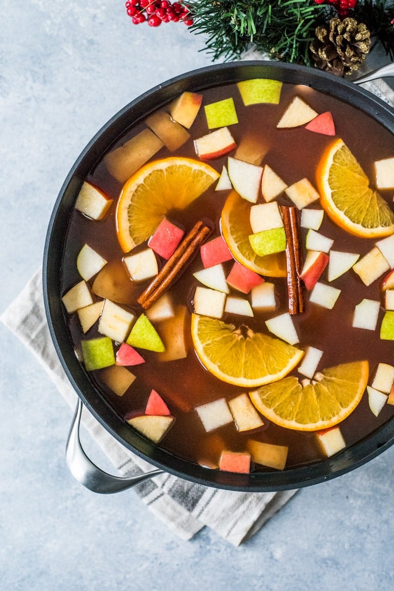 Mexican Ponche is a warm and comforting fruit punch made with apples, pears, oranges and guavas and spiced with cinnamon, cloves, tamarind and hibiscus typically served at Christmas time.