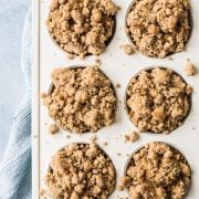 These cinnamon coffee cake muffins topped with a crunchy streusel topping are made with Greek yogurt for a healthier homemade treat!