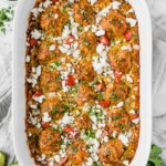Gluten free chicken meatballs covered in a red enchilada sauce