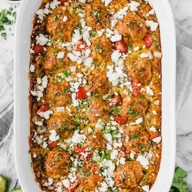 Gluten free chicken meatballs covered in a red enchilada sauce