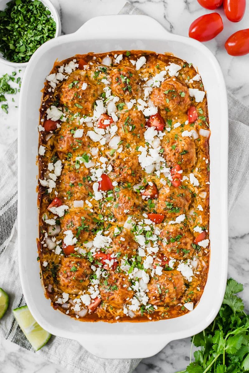 Gluten free chicken meatballs covered in a red enchilada sauce