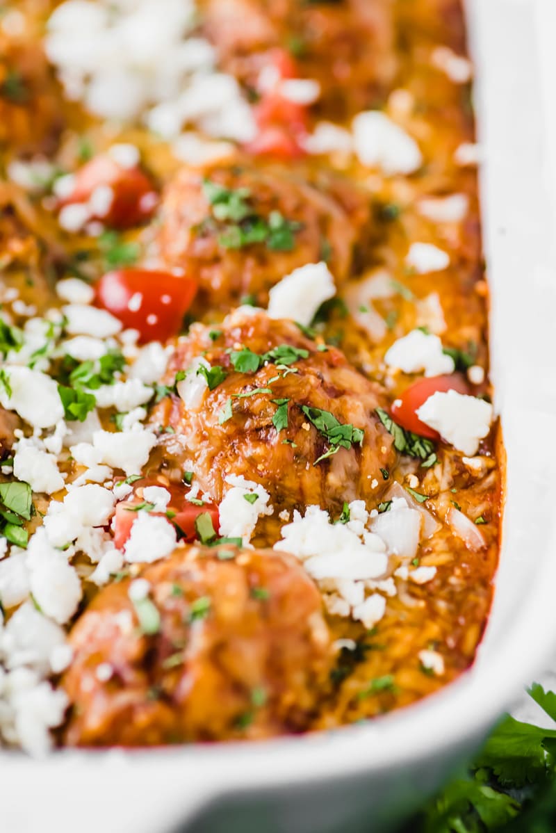 Gluten free chicken meatballs covered in a red enchilada sauce