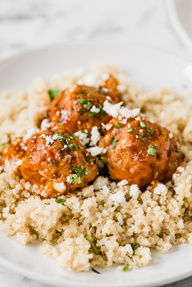 Gluten free chicken meatballs covered in a red enchilada sauce