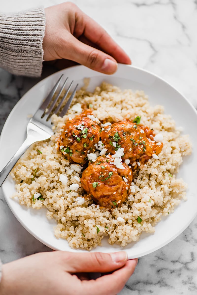 Gluten free chicken meatballs covered in a red enchilada sauce