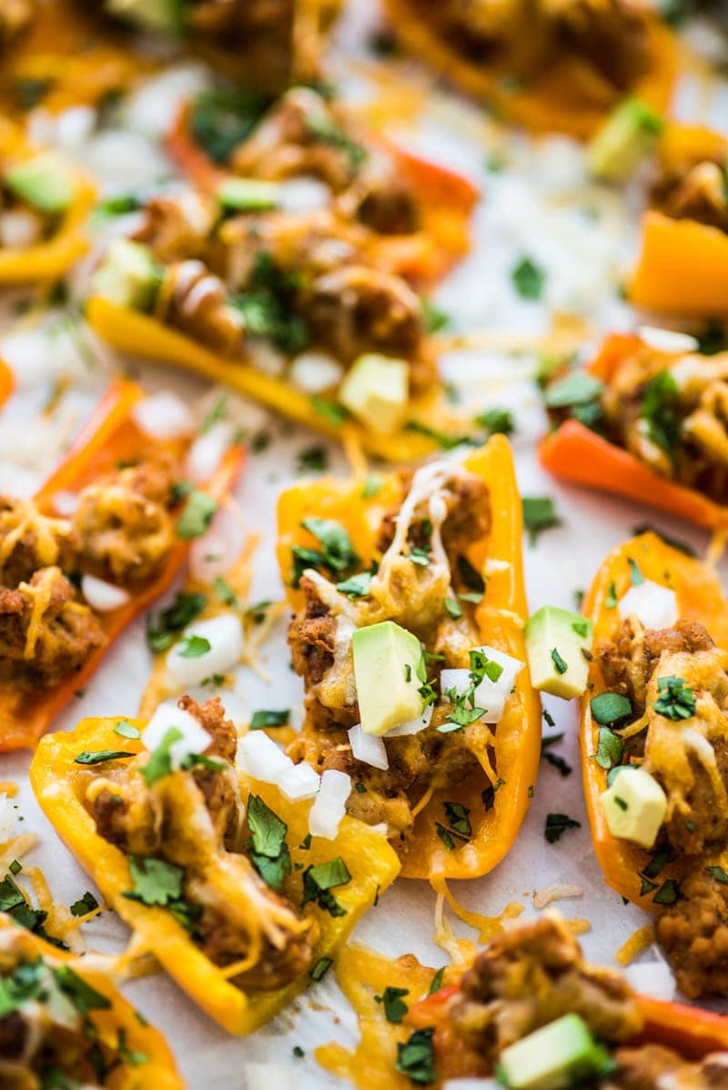 This Healthy Chicken Nachos recipe is made with mini bell peppers instead of tortilla chips! It's Low carb, gluten free and grain free!