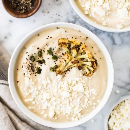 This Roasted Cauliflower Soup with Fried Jalapeños is thick, creamy and loaded with healthy veggies. It's also gluten free, paleo, vegetarian and vegan!