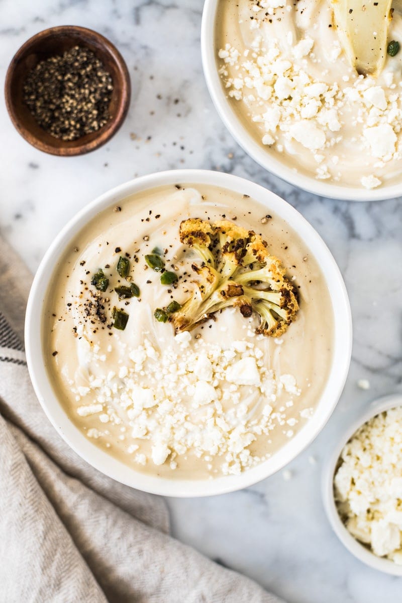 This Roasted Cauliflower Soup with Fried Jalapeños is thick, creamy and loaded with healthy veggies. It's also gluten free, paleo, vegetarian and vegan!