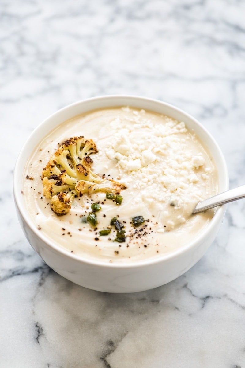 This Roasted Cauliflower Soup with Fried Jalapeños is thick, creamy and loaded with healthy veggies. It's also gluten free, paleo, vegetarian and vegan!