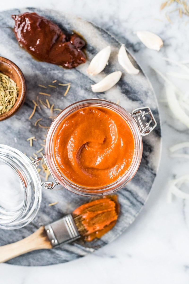 This homemade Sugar Free BBQ Sauce is made with chipotle peppers, caramelized onions and a blend of spices that's healthy, wholesome and insanely addicting! It's gluten free, dairy free, paleo, vegetarian and vegan. #bbqsauce #barbecue #sugarfree #bbq