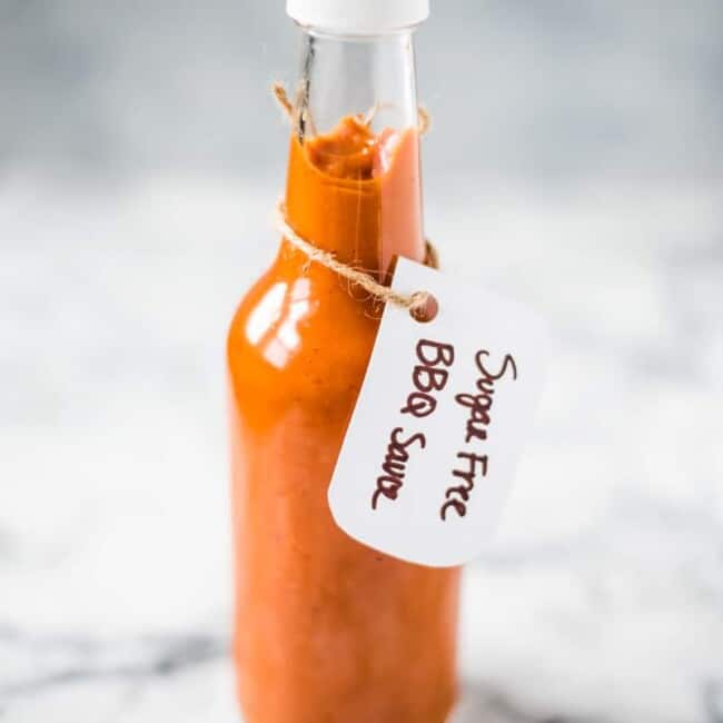 This homemade Sugar Free BBQ Sauce is made with chipotle peppers, caramelized onions and a blend of spices that's healthy, wholesome and insanely addicting! It's gluten free, dairy free, paleo, vegetarian and vegan. #bbqsauce #barbecue #sugarfree #bbq