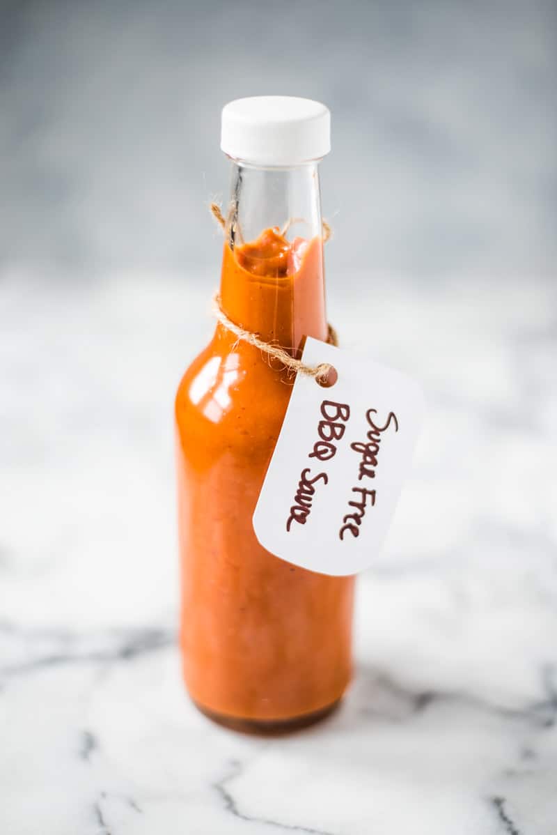 This homemade Sugar Free BBQ Sauce is made with chipotle peppers, caramelized onions and a blend of spices that's healthy, wholesome and insanely addicting! It's gluten free, dairy free, paleo, vegetarian and vegan. #bbqsauce #barbecue #sugarfree #bbq