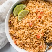 My Mom's Authentic Mexican Rice Recipe is made with simple ingredients like chopped tomatoes, onions and garlic and is the perfect side dish for any meal.