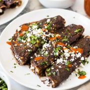 Enfrijoladas - Mexican enchiladas covered in a black bean sauce stuffed with cheese and ready in only 15 minutes! (vegetarian, gluten free)