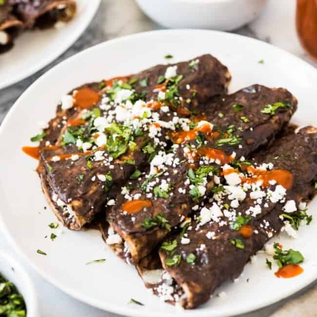 Enfrijoladas - Mexican enchiladas covered in a black bean sauce stuffed with cheese and ready in only 15 minutes! (vegetarian, gluten free)