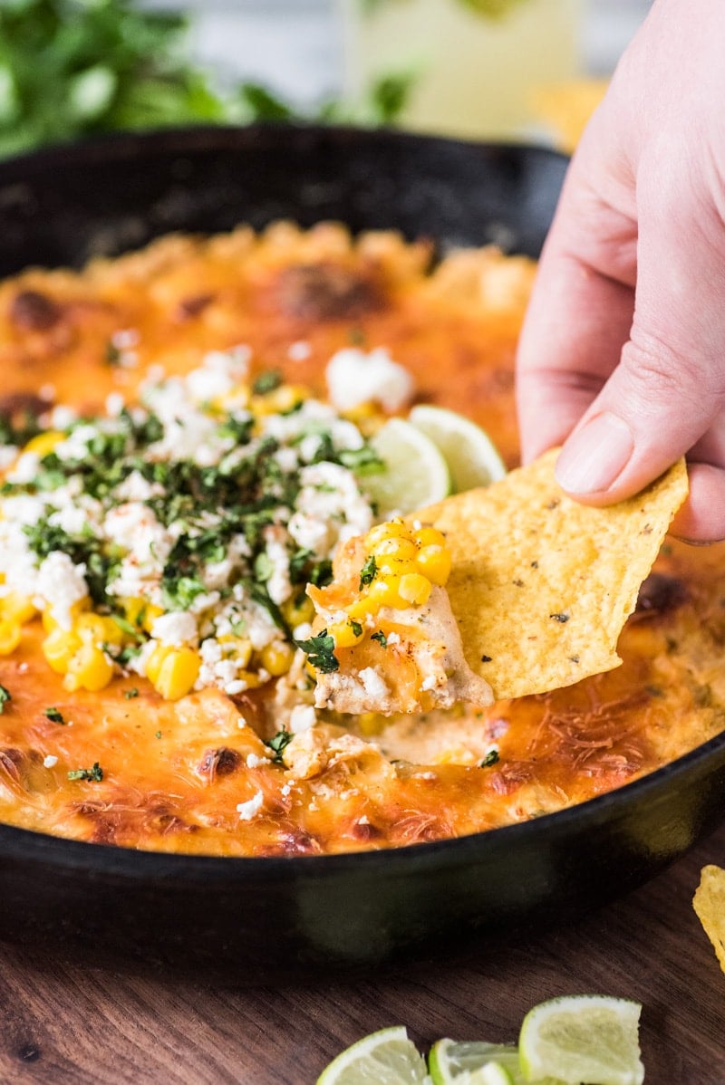 This Mexican Corn Dip recipe made whole kernel corn, lots of cheese and a blend Mexican spices is creamy, satisfying and addicting. It's the perfect appetizer for parties and celebrations like Cinco de Mayo!