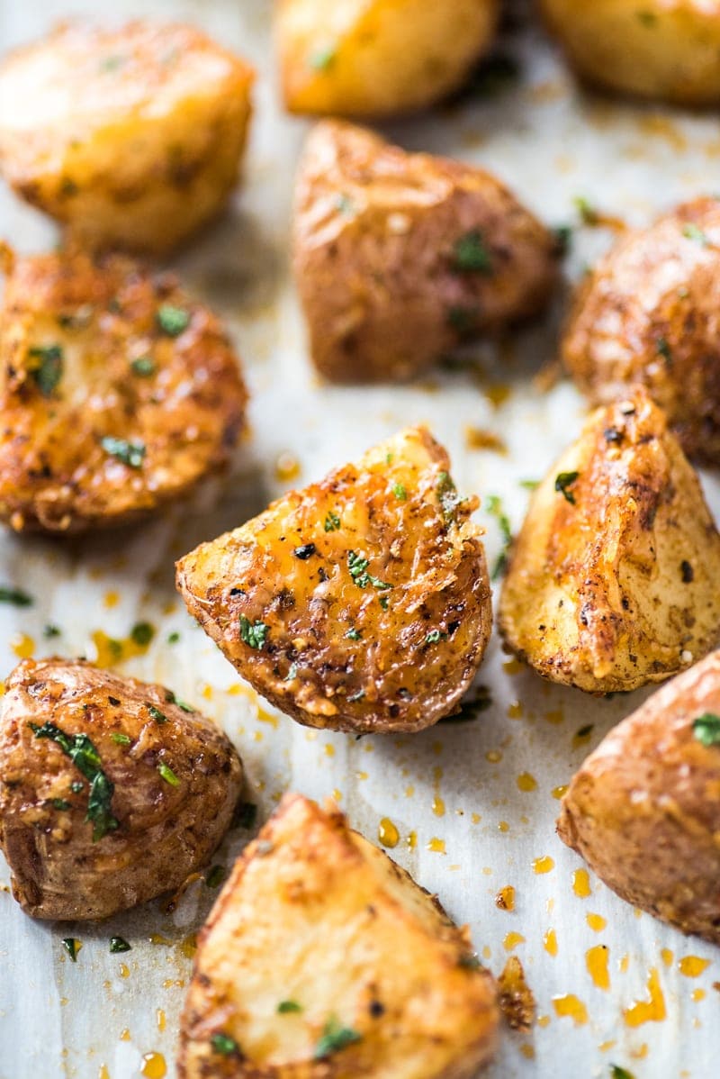 Crispy roasted Mexican potatoes on parchment paper.