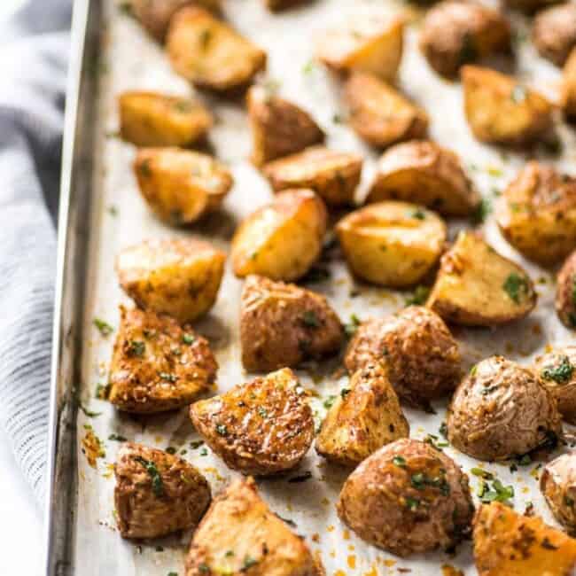 These Mexican Crispy Roasted Potatoes seasoned with chili powder, garlic, sea salt and Parmesan cheese are baked, not fried and are the perfect side to weekday meals. (gluten free, vegetarian)