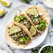 Seasoned with oregano, cumin, chili powder, lime juice, these Mexican Slow Cooker Pork Carnitas Tacos are the perfect meal for any night of the week. (gluten free, dairy free, paleo, healthy, clean eating) // isabeleats.com