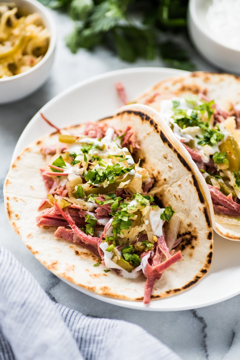 Corned beef tacos filled with shredded corned beef made in a slow cooker