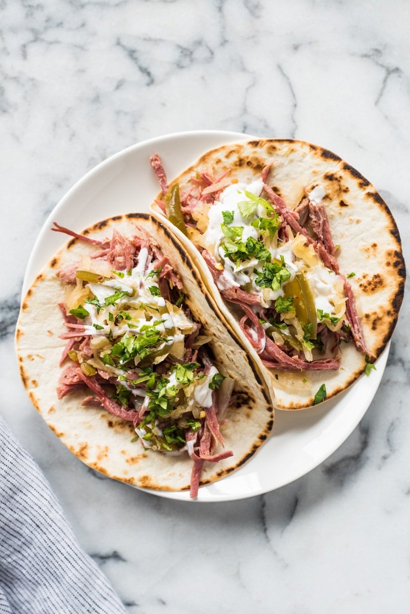 Slow cooker corned beef tacos on a plate