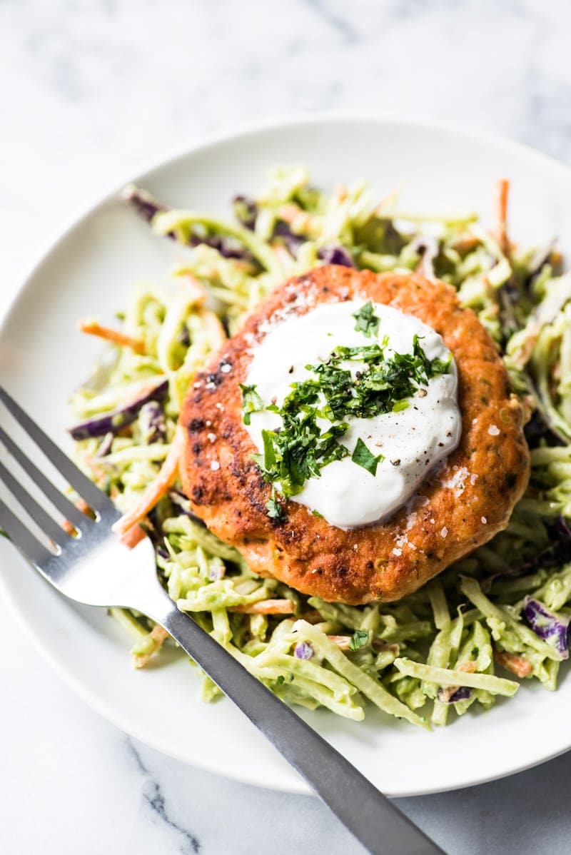 These jalapeno salmon patties are quick and easy to make and are the best healthy dinner paired with an avocado broccoli slaw. (low carb, gluten free, paleo)