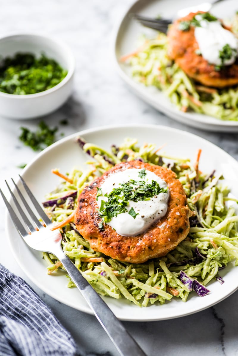 These jalapeno salmon patties are quick and easy to make and are the best healthy dinner paired with an avocado broccoli slaw. (low carb, gluten free, paleo)