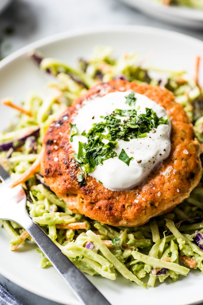 These jalapeno salmon patties are quick and easy to make and are the best healthy dinner paired with an avocado broccoli slaw. (low carb, gluten free, paleo)