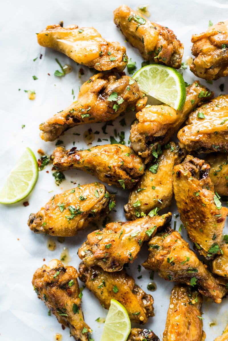 This crispy chicken wings recipe creates flavorful crispy wings without using extra flours or coatings! Topped with a finger-licking good honey lime sauce, these wings are gluten free, low carb and paleo.