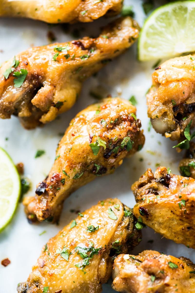 This baked chicken wings recipe creates flavorful crispy wings without using extra flours or coatings! Topped with a finger-licking good honey lime sauce, these wings are gluten free, low carb and paleo.