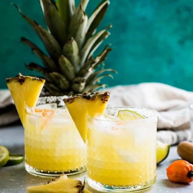 This pineapple margarita is made with sweet pineapple juice and a fresh habanero pepper for a spicy twist on a refreshing cocktail!