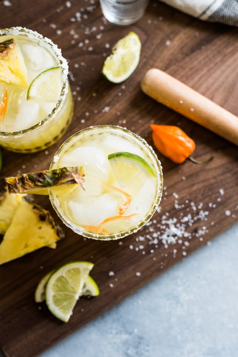 This pineapple margarita recipe is made with sweet pineapple juice and a fresh habanero pepper for a spicy twist on a refreshing cocktail! Perfect for Cinco de Mayo!