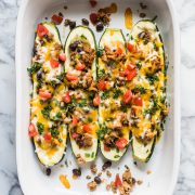 Zucchini Boats are stuffed with chipotle seasoned ground turkey, black beans, cheese and all your favorite toppings. It's the perfect healthy, gluten free and low carb meal for any night of the week!