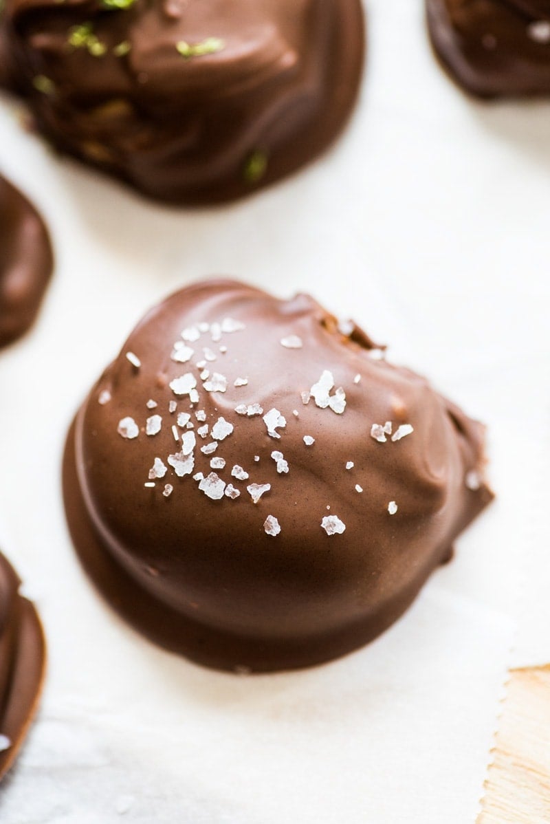 These chocolate covered almond butter balls are made with only 3 ingredients and are the perfect healthy dessert! All you need is almond butter, coconut flour and chocolate chips! They're like a healthy reese's cup!