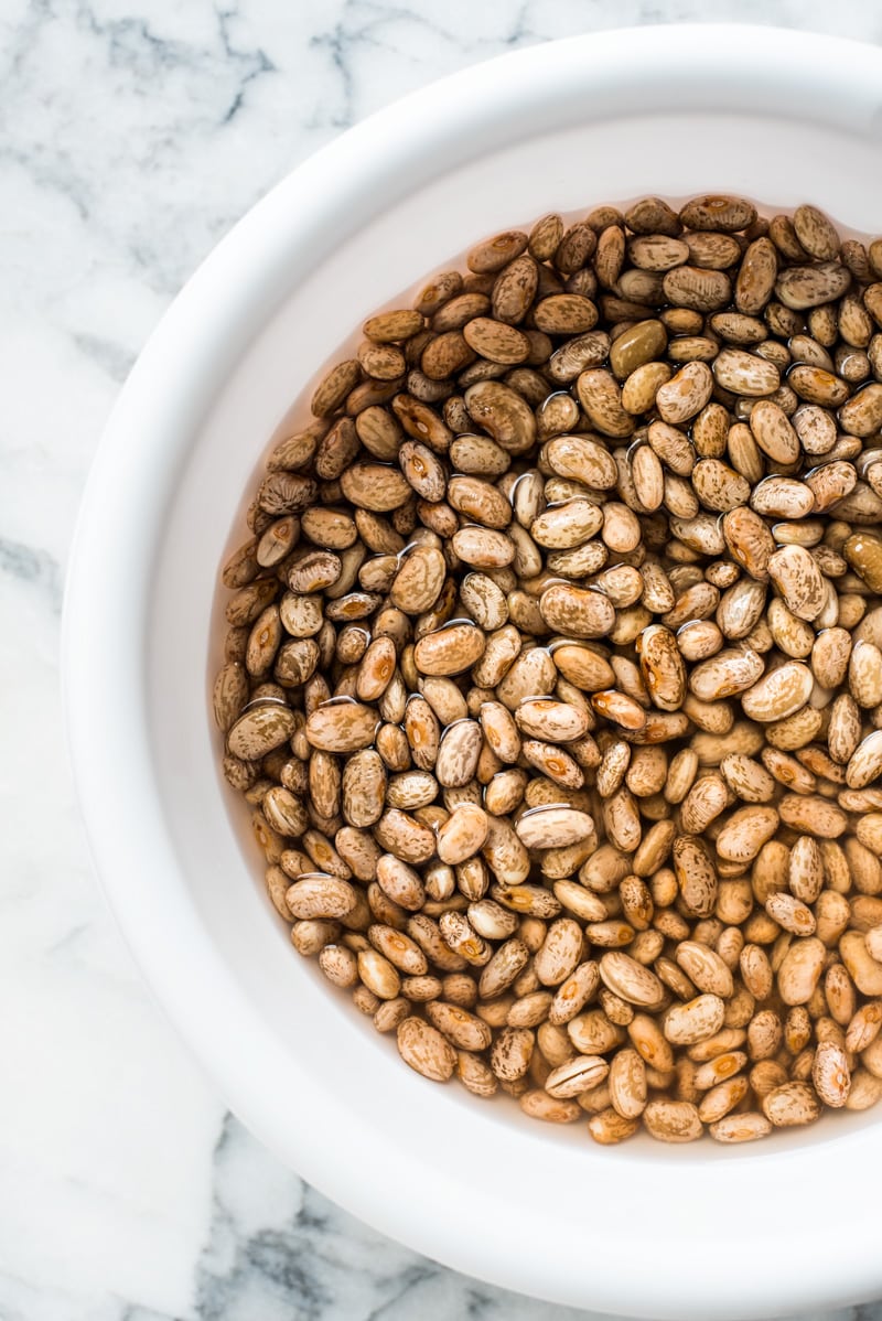 How to make charro beans - first step is to soak pinto beans.