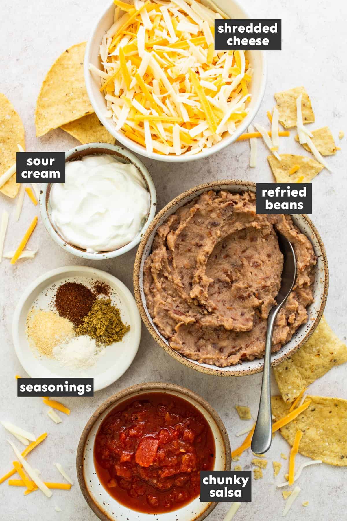 Ingredients in bean dip on a table.