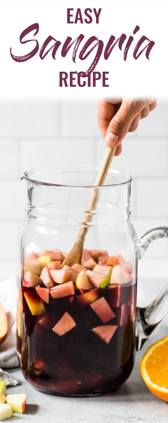 This Sangria Recipe is made with only 6 ingredients including diced apples, oranges and Spanish red wine and is the easiest red sangria ever! It's the perfect easy summer drink for a crowd and requires only 5 minutes to make! #sangria #cocktail #wine