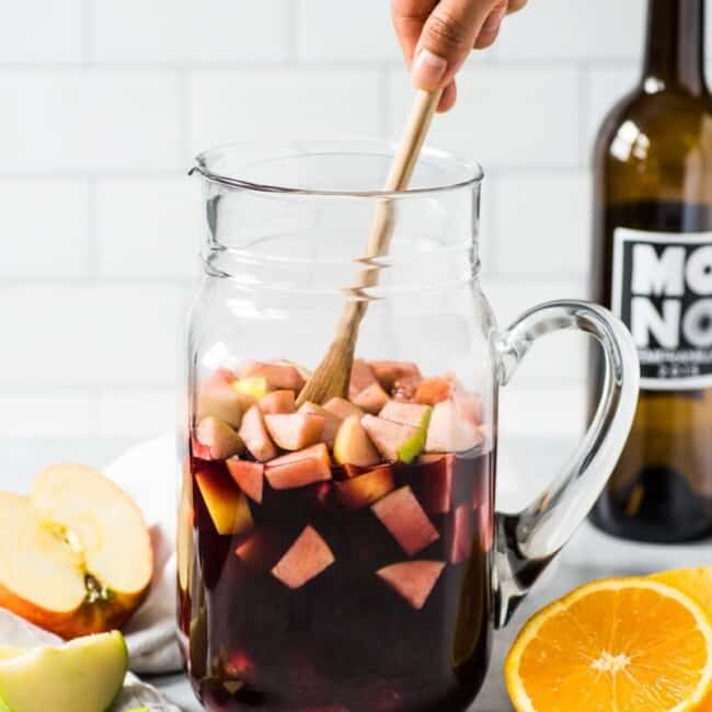 This Sangria Recipe is made with only 6 ingredients including diced apples, oranges and Spanish red wine and is the easiest red sangria ever!