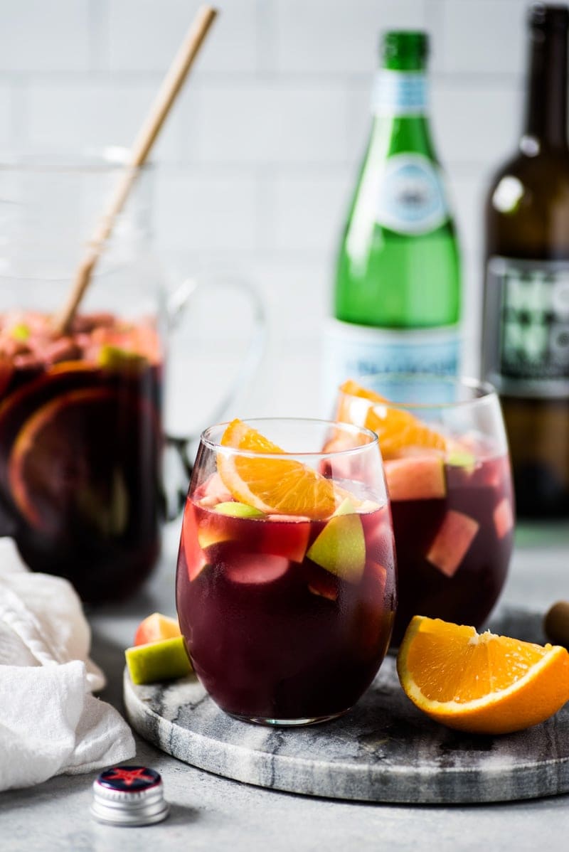 Sangria recipe made with red wine and fruits in a glass.