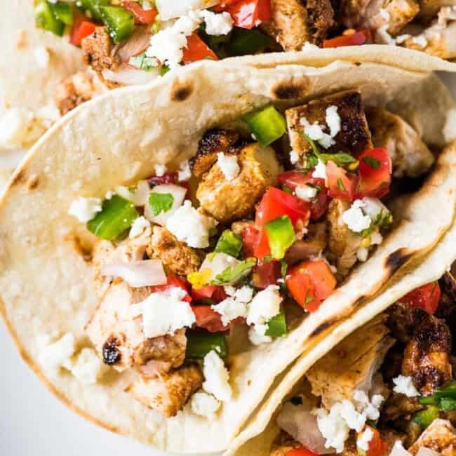These simple yet flavorful chicken tacos are easy to make and filled with super juicy and delicious boneless skinless chicken thighs. Perfect for weeknight meals and makes great leftovers! #tacos #mexican #glutenfree