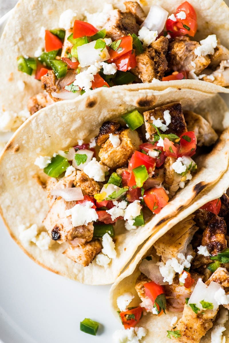These simple yet flavorful chicken tacos are easy to make and filled with super juicy and delicious chicken! Perfect for weeknight meals and makes great leftovers!