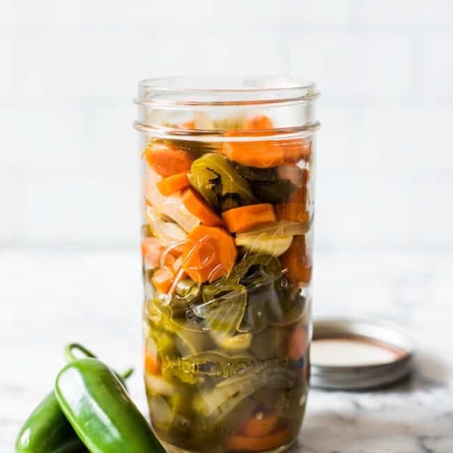 These Pickled Jalapenos are easy to make and are great for topping on all your favorite Mexican foods like nachos, tacos and enchiladas!