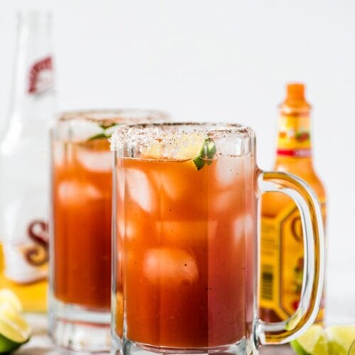 This refreshing Michelada recipe made with Clamato juice and Mexican beer is the perfect cocktail for brunch or alongside your favorite Mexican party foods!