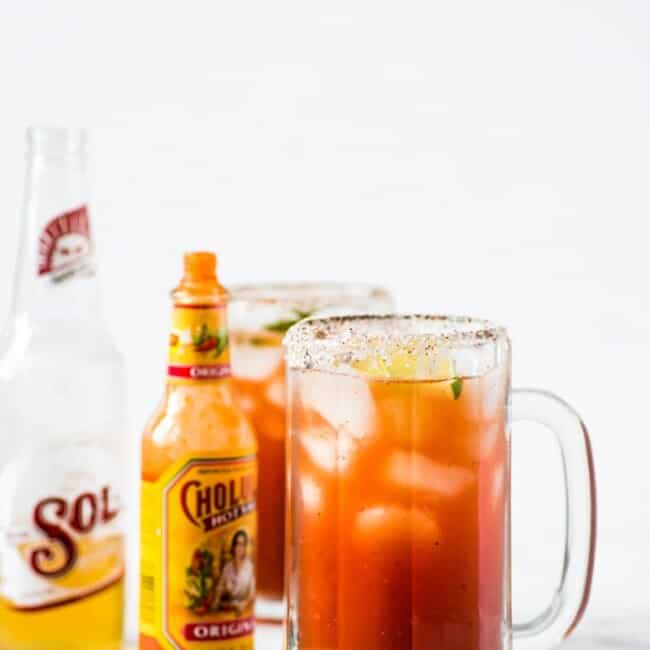This refreshing Michelada recipe made with Clamato juice and Mexican beer is the perfect cocktail for brunch or alongside your favorite Mexican party foods!
