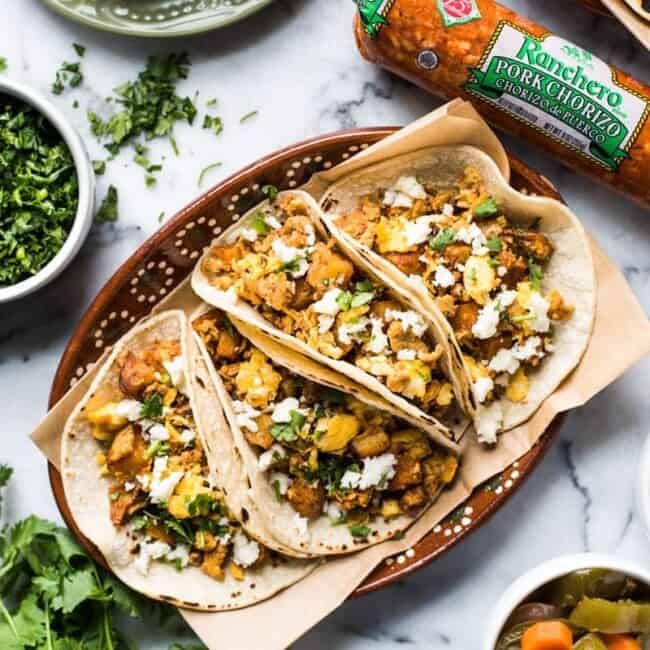 These Breakfast Tacos are made with chorizo, crispy potatoes and eggs and are an authentic Mexican breakfast perfect for any day of the week!