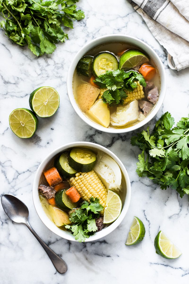 Caldo de Res, or Mexican beef soup, is a healthy and comforting soup made with a flavorful beef broth and squash, corn, carrots, cabbage and potatoes. 
