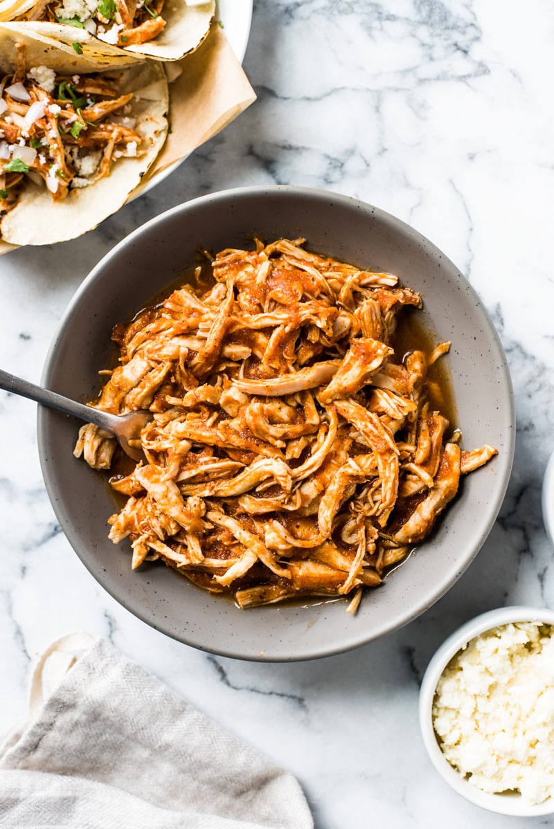 These Easy Chicken Tinga Tacos feature shredded chicken in a smoky chipotle sauce that's ready in only 30 minutes! (gluten free, low carb, paleo)